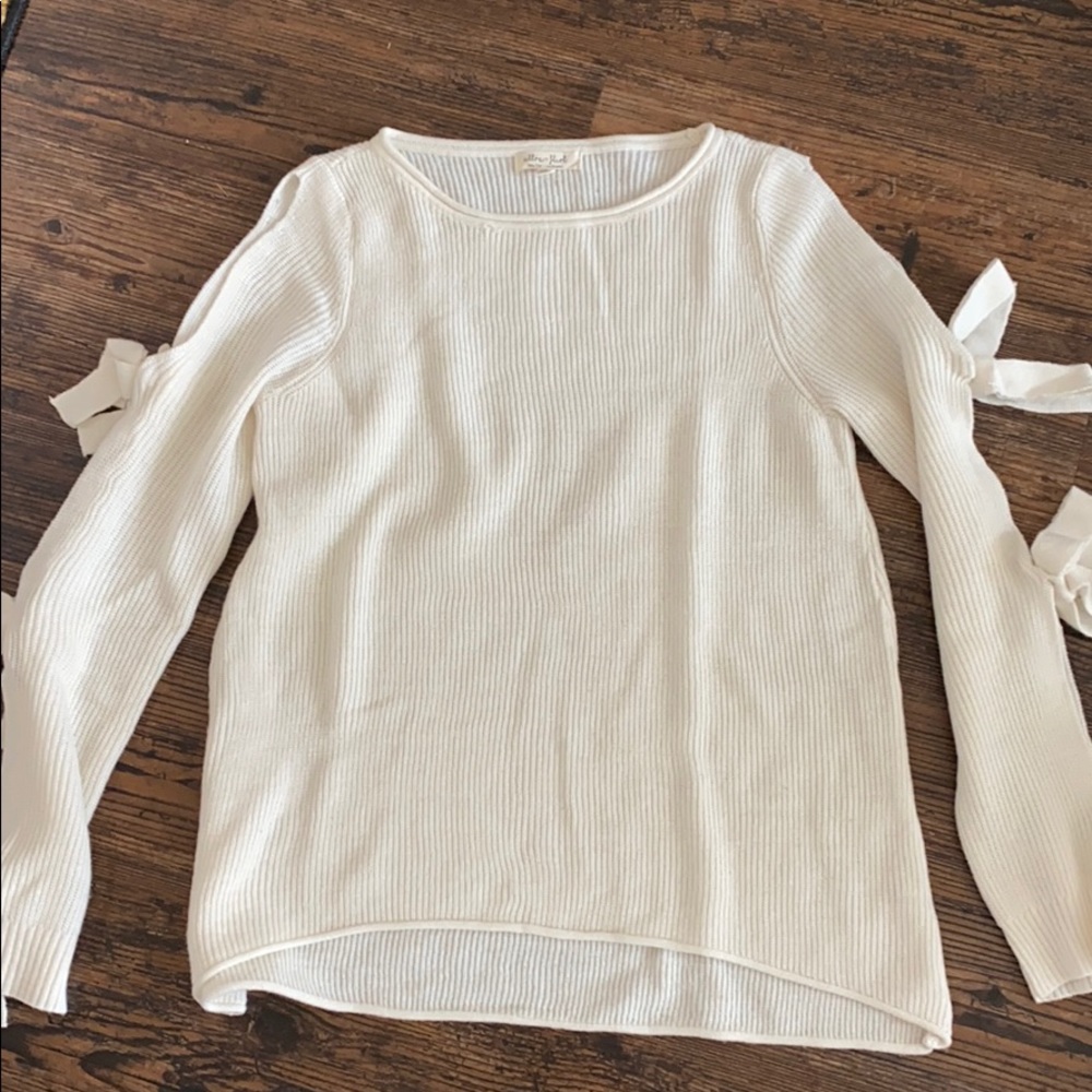 Off white sweater with open sleeves and ties